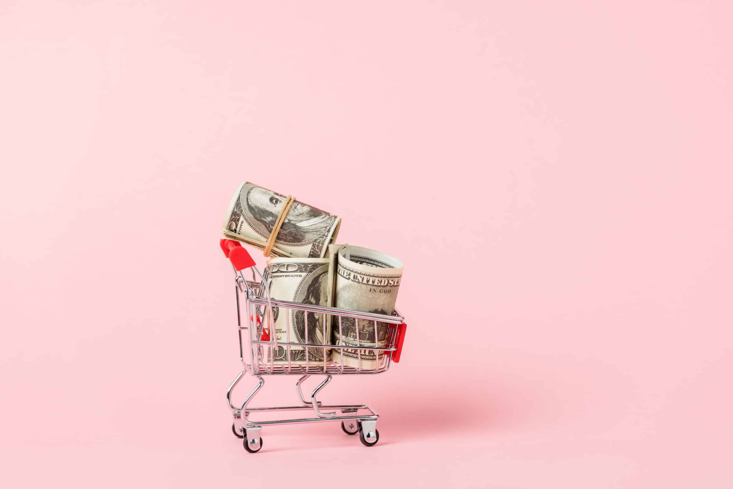 shopping cart cash money - Groceries laying on table with brown paper bag with text that says "How To Make Money As An Instacart Shopper" for an Instacart Shopper Review article